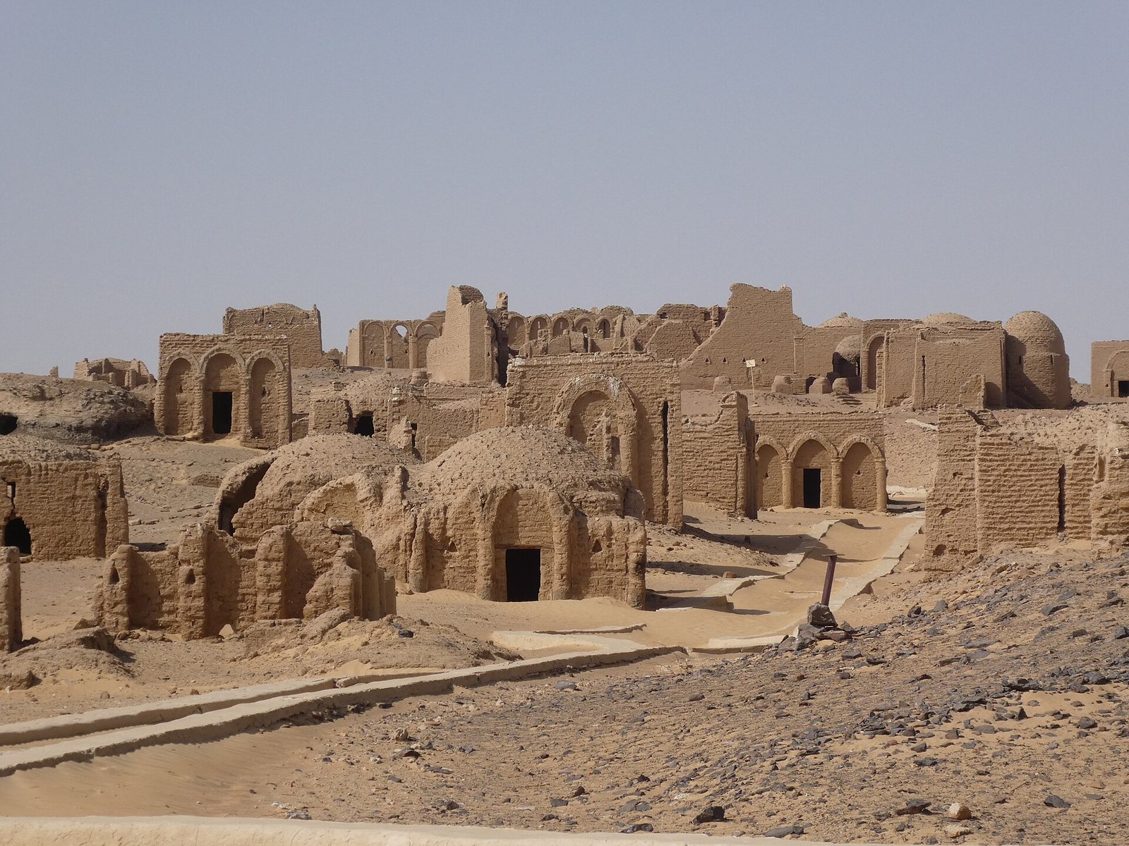 General view of the mudbrick chapels at El Bagawat, photographed among the sandy hills of Kharga Oasis